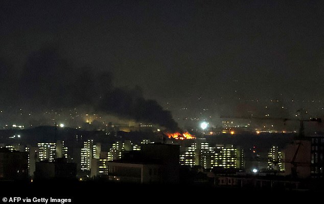 Smoke and fire rise from the site of airstrikes at Mehrabad International Airport in Tehran on March 7, 2026. Israel said on March 7 it had launched "broad-scale" strikes on targets in Tehran, as the Iranian state broadcaster reported an explosion in the western part of the city. (Photo by ATTA KENARE / AFP via Getty Images)