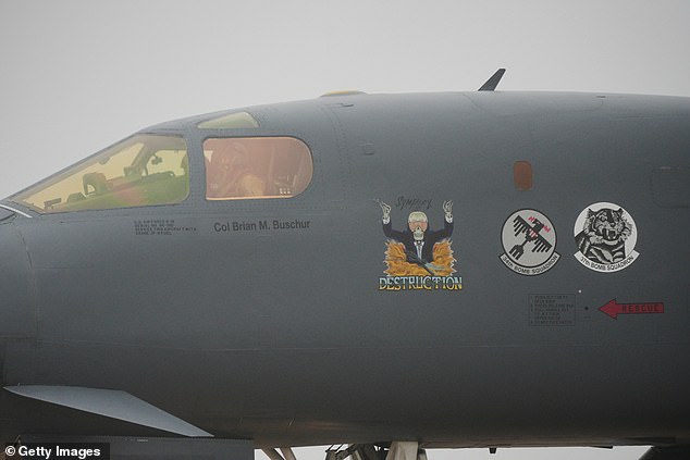 A US Airforce Rockwell B-1 Lancer bomber named 'Symphony of destruction' touches down