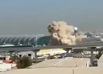 Shocking moment Dubai airport hit in Iran suicide drone blitz as all flights suspended 'until further notice'