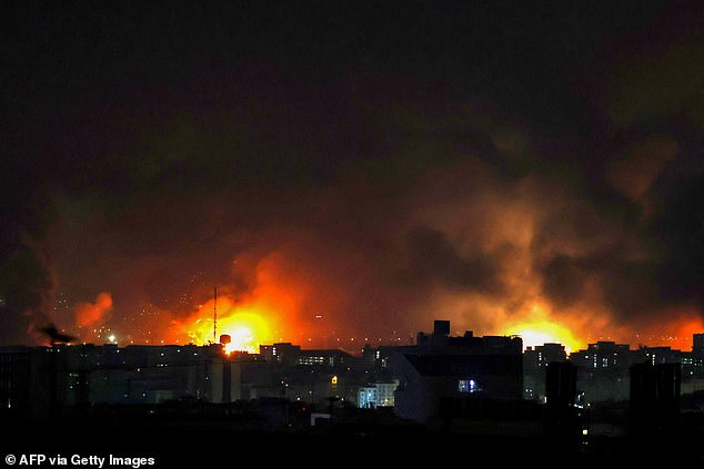 Smoke and fire rise from the site of airstrikes at Mehrabad International Airport in Tehran on March 7