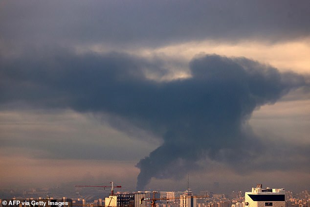 Smoke rises above the Iranian capital, Tehran, following further airstrikes on Saturday