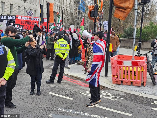 Police had to intervene to defuse a confrontation after a single counter protestor heckled the crowd in a Union Jack flag