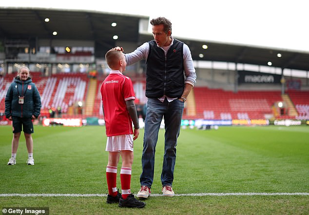 The Deadpool actor stopped to pose with club mascots on the pitch prior to the game starting