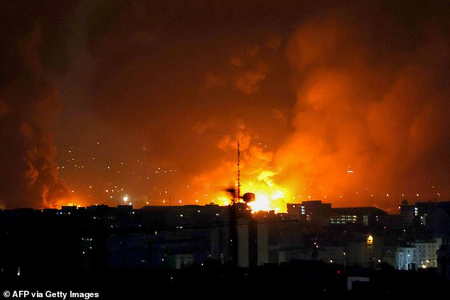 Smoke and fire rise from the site of airstrikes at Mehrabad International Airport in Tehran on March 7