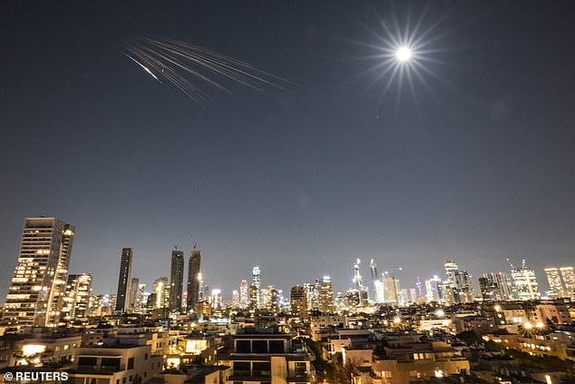 An Iranian missile with cluster munitions flies towards Israel amid the U.S.-Israeli conflict with Iran