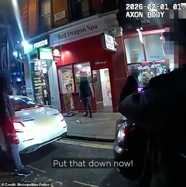Bodyworn footage (pictured) shows one of the constables shouting, 'Hey! Put that down now!', as she crosses the road to confront the individual head-on