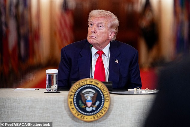 The president promised to continue striking Iran as tensions escalate in the region. He's pictured at a roundtable discussion on Friday at the White House