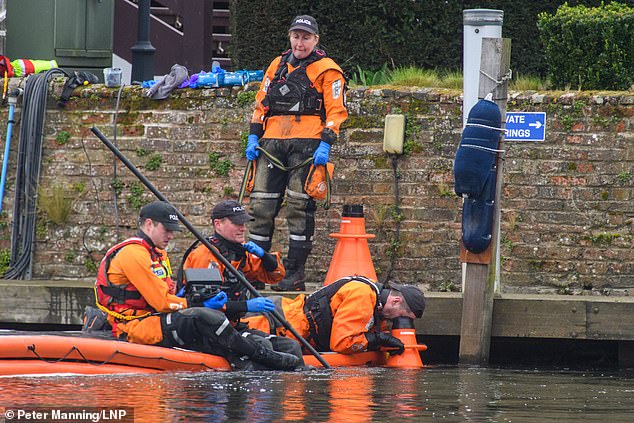 A 44-year-old man was arrested at the scene, on suspicion of murder. Pictured: A police search team and forensic investigators search for evidence in the River Thames