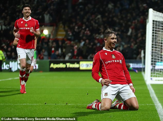 Callum Doyle celebrates scoring Wrexham's second goal of the game against Chelsea