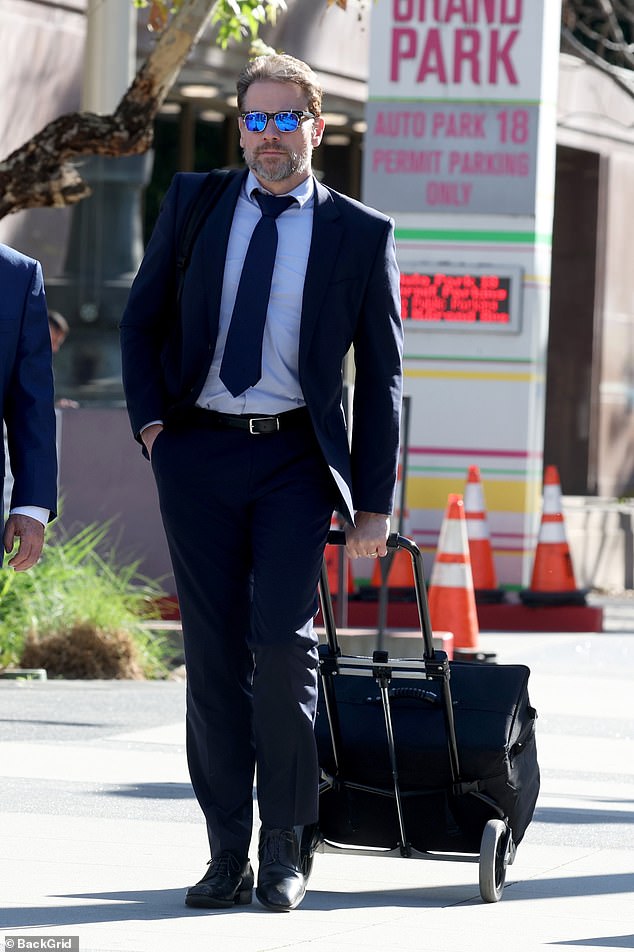 Meanwhile, Ioan briefly exchanged a smile with his lawyers but otherwise remained poker-faced as he departed the Stanley Mosk Courthouse