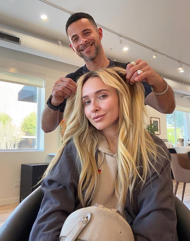 The actress looked radiant as she flashed a beaming smile from the hair salon chair, while her stylist showcased the long, golden strands in all their glory