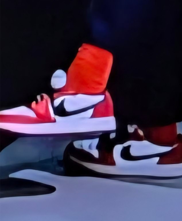 A close up of the vivid red trainers and even brighter red socks, with viewers branding the outfit 'unprofessional'