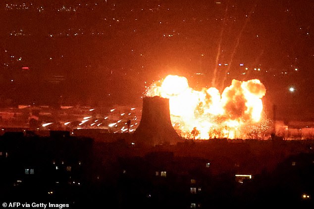 The IDF confirmed it had carried out strikes on the Iranian regime's infrastructure on Saturday night. Pictured: Flames erupt near to Mehrabad International Airport
