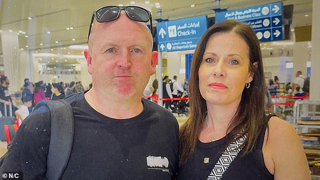 British tourist Mike Linn from Edinburgh said he came to the airport determined to leave, despite the drone chaos. Pictured: Mike and Lisa Linn at the airport