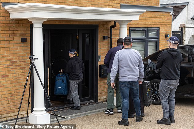 The men, who are Iranian and dual British-Iranian, are suspected of surveilling Jewish 'locations and individuals'. Pictured: Police at an address in Watford in relation to the arrest operation