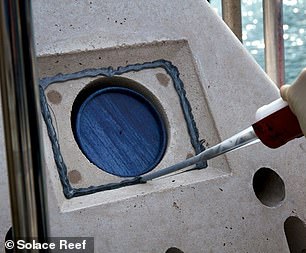 The ashes are sealed behind a stone plaque that is regularly cleaned by divers