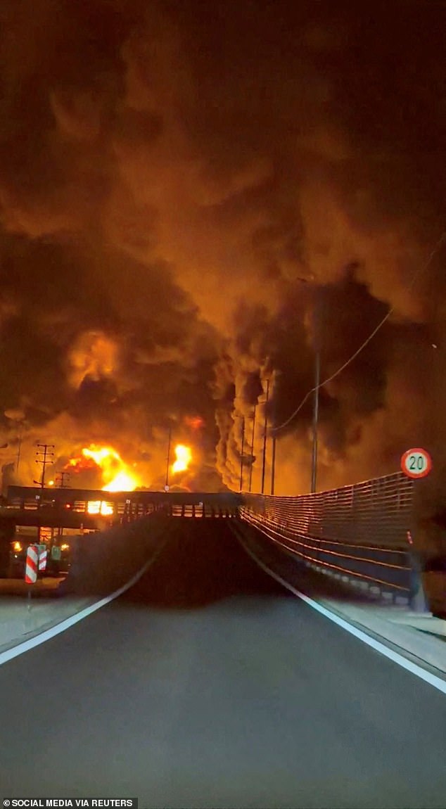 Fire burns and smoke rises from Aqdasieh Oil Depot after being reportedly hit by strike, amid the US-Israeli conflict with Iran, in Tehran, Iran in this screengrab taken from a social media video released on March 8, 2026