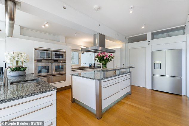 The kitchen has a modern, sleek design