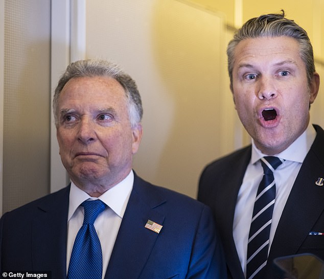 US Secretary of War Pete Hegseth (right) said 'we're certainly investigating' who was behind the attack, but agreed with Trump that it is something Iran might have done