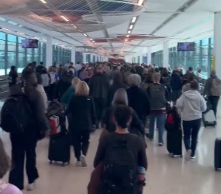 People walking in an airport terminal.
