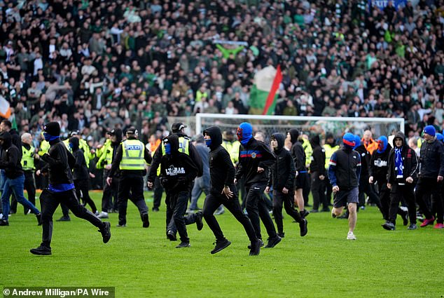 Fans of both clubs invaded the pitch in scenes that have been condemned by the Scottish FA