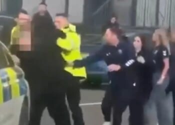 Shocking moment huge brawl erupts after football match as cops tackle fans to the ground & five arrested