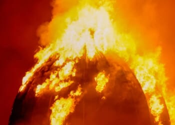 Buildings collapse & major UK train station at risk as 60 firefighters battle huge inferno leaving hundreds stranded