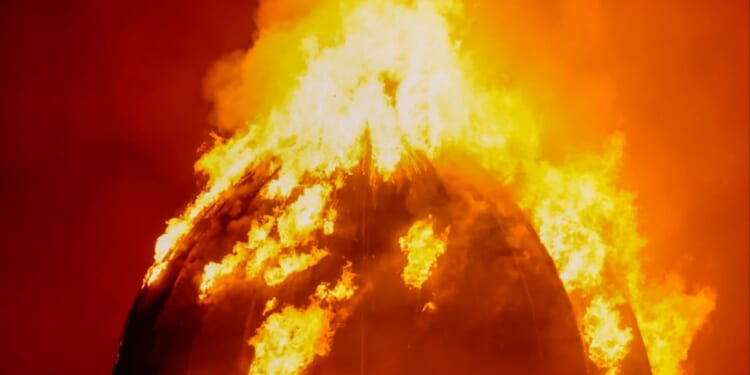 Buildings collapse & major UK train station at risk as 60 firefighters battle huge inferno leaving hundreds stranded