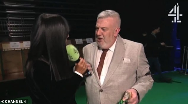 In his excitement he knocked the microphone, which hit Claudia in the chin as she tried her best to keep the show on the road