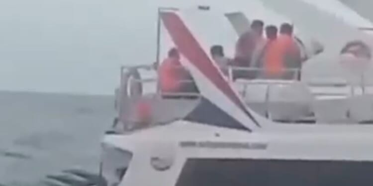 Moment boat carrying hundreds of tourists in Bali fills up with water after 'hull fracture' caused by massive waves