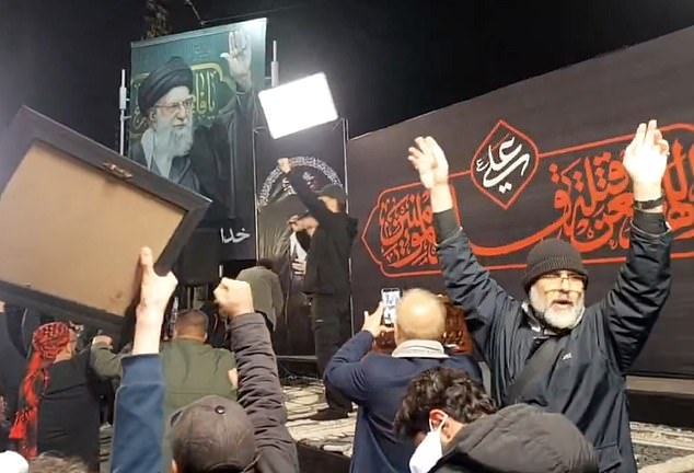 Large crowds in Tehran wave Iranian flags and shout, 'Allahu Akbar, Khamenei Rahbar', meaning: 'God is great, Khamenei is the leader'
