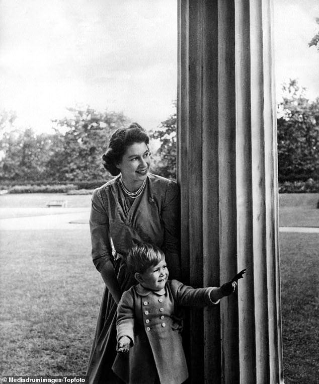 Pictured in 1950: Queen Elizabeth plays with Charles, aged two