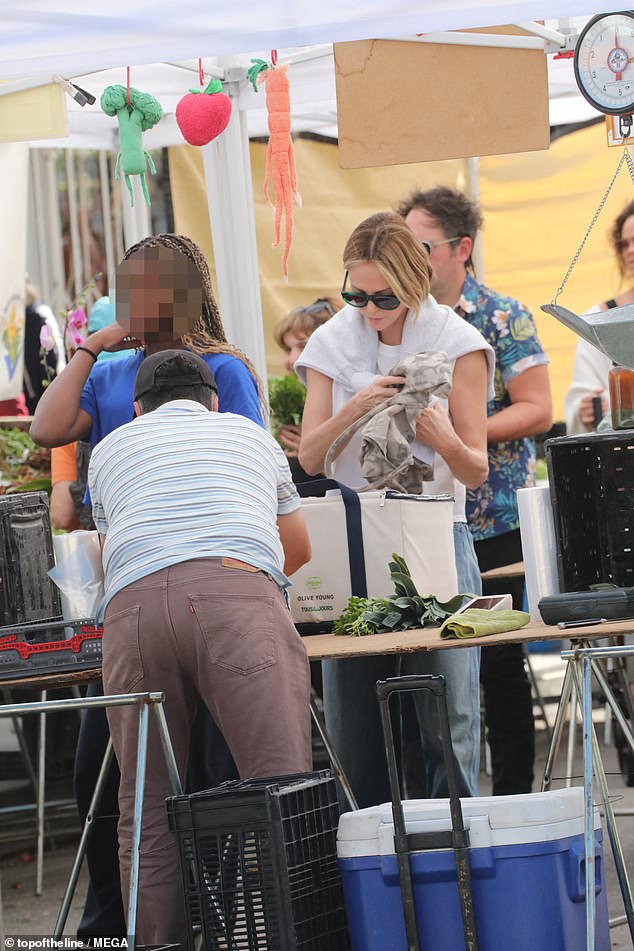 Meanwhile Jackson was casual cool in a blue t-shirt, oversized navy sweatpants and UGG slippers