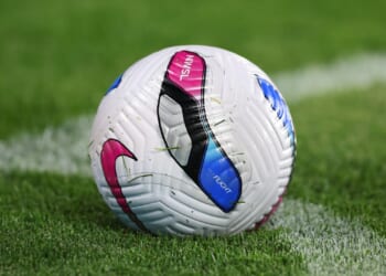 Football match turns into horrifying brawl as player's brother 'stabs rival in the groin' as he's rushed to hospital