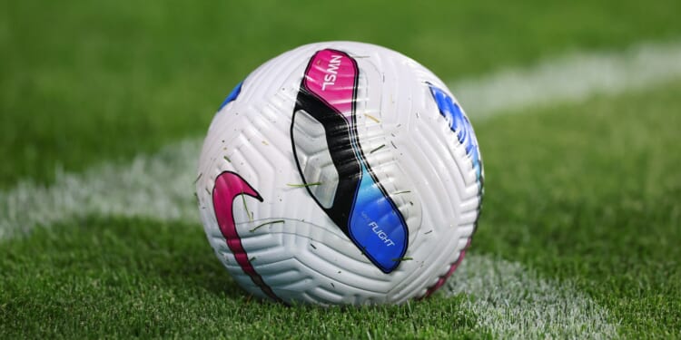 Football match turns into horrifying brawl as player's brother 'stabs rival in the groin' as he's rushed to hospital