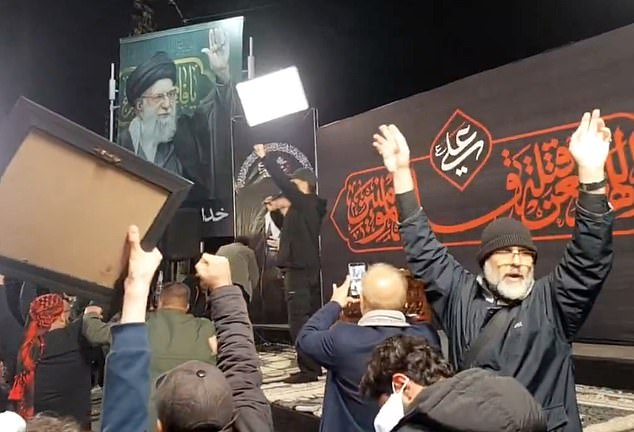 Large crowds in Tehran wave Iranian flags and shout, 'Allahu Akbar, Khamenei Rahbar', meaning: 'God is great, Khamenei is the leader'