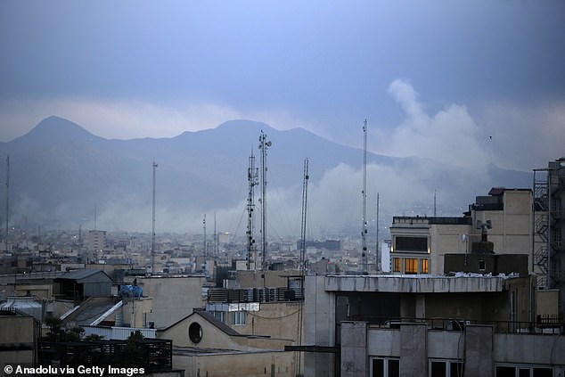 Smoke rises into the air after an attack by the US/Israel coalition on Tehran yesterday