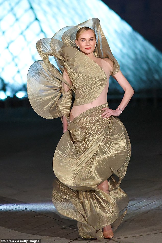 Diane Kruger, 49, pulled out all the stops in an eye-popping gown, which displayed her toned physique at the Louvre Museum gala dinner