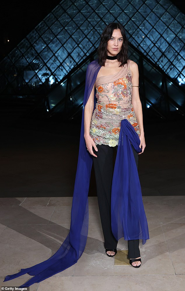 Alexa Chung cut a quirky figure in a sequin dress over black trousers at the Louvre Museum gala dinner