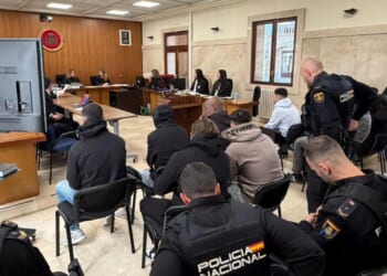 EIGHT men due to be tried today over the Magaluf hotel gang rape of a British teenage tourist they filmed being sexually