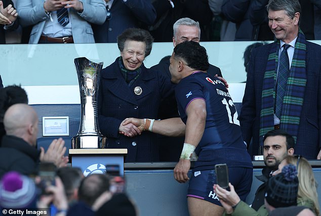 Anne and the Scots captain then erupted into laughter before the princess followed protocol by shaking hands with the Scottish rugby player and exchanging a few warm words