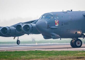 Iconic US B-52 bombers that can each carry 31 TONNES of weaponry land in Britain as Trump gathers vast Iran strike force