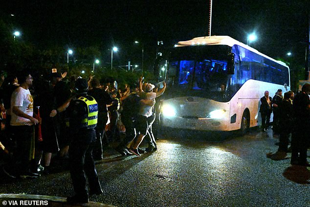 After their final match against the Philippines, around 200 protestors surrounded the team bus, banging on it and chanting 'let them go' as police pushed the crowd back
