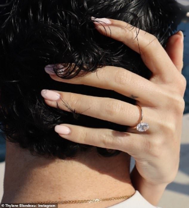 The French model shared photos of her engagement ring - an enormous diamond set in a simple, solid gold band