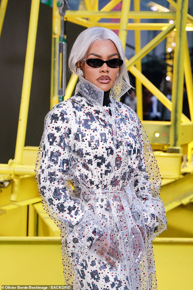 She added dark shades to her look and posed up a storm