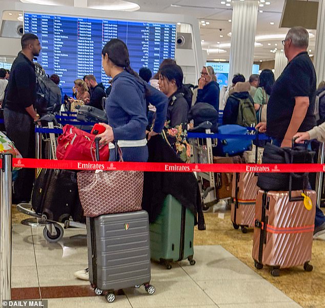 Passengers in the terminal at Dubai Airport on Saturday after the airport closed again due to drone strikes
