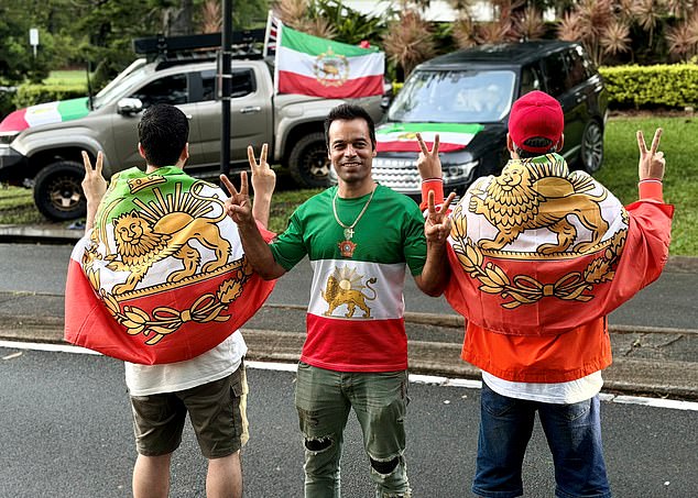 Supporters remain outside the Royal Pines Resort on the Gold Coast, where the rest of the Iranian team are currently holed up