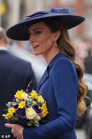 The earrings feature round diamond studs, from which hang round and baguette-cut diamonds arranged in a style typical of the late 1940s