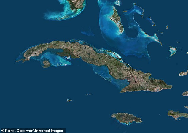 Cuba sits just 90 miles south of Florida at its closest point and can be seen at the top of this satellite image