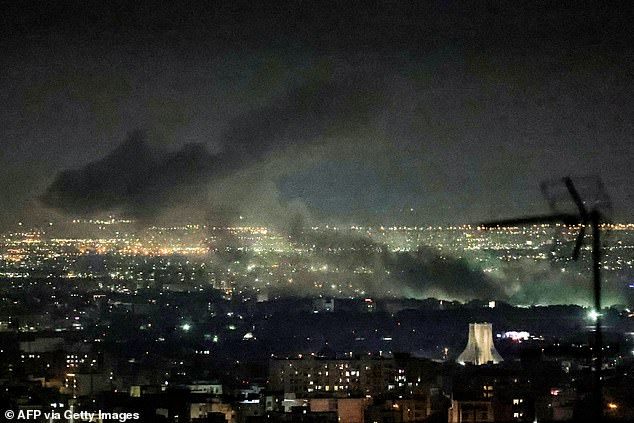 Smoke billows above Tehran on Tuesday as the US and Israel continue to launch attacks against the regime